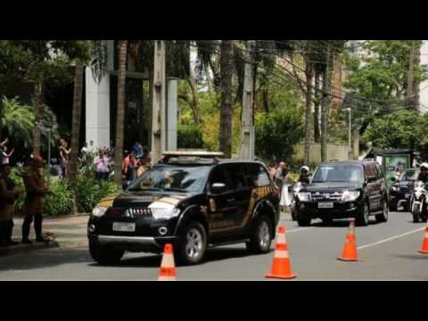 Car carrying Lula heads to court in Brazil as supporters watch