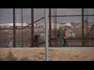 Migrants cross the US-Mexico border and turn themselves in