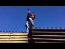 Central American migrants try to breach US-Mexico border fence