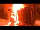 Protesters set cars on fire in Paris
