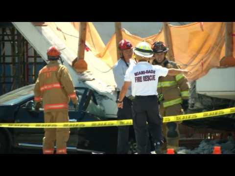 Rescue workers arrive on site after Miami bridge collapses