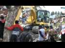 Indonesian rescuers search devastated neighbourhood
