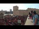People march in south of France to support migrant rescue ship