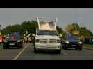 Pope Francis drives through streets of Vilnius in Popemobile