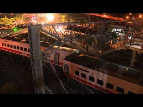 Rescue workers on site of a deadly train crash in Taiwan