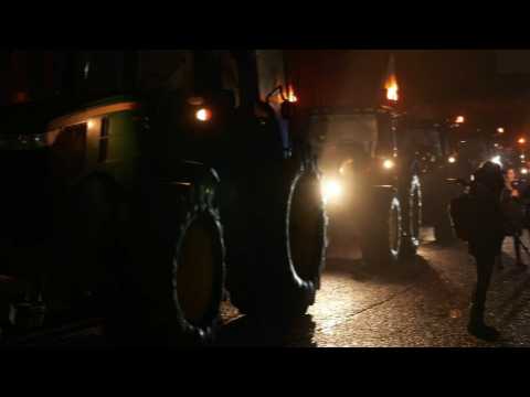 French farmers slow-driving their tractors on motorway in protest
