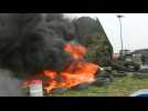 French Farmers burn tyres by food retailer's warehouses