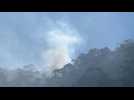 Firefighters put out forest fires on hill next to Colombian capital