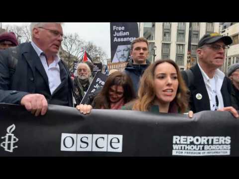 Julian Assange's supporters march to UK Prime Minister's office