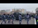 Navalny mourners throw flowers on hearse leaving church