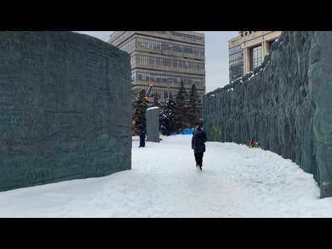 People leave flowers at makeshift Moscow memorial for Navalny