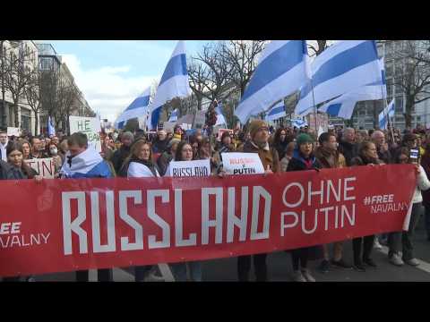 Protesters gather near the Russian embassy in Berlin on last day of presidential election