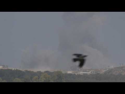 Smoke billows as air strike hits central Gaza, seen from Israel