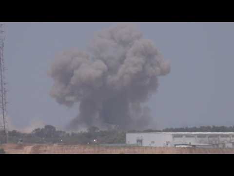 Smoke billows following strikes on central Gaza, seen from Israel