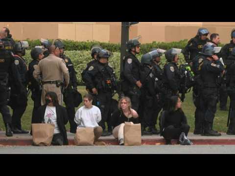Detained students on UCLA campus after police cleared pro-Palestine protest camp