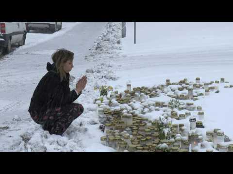 People pay their respects outside scene of deadly school shooting in Finland