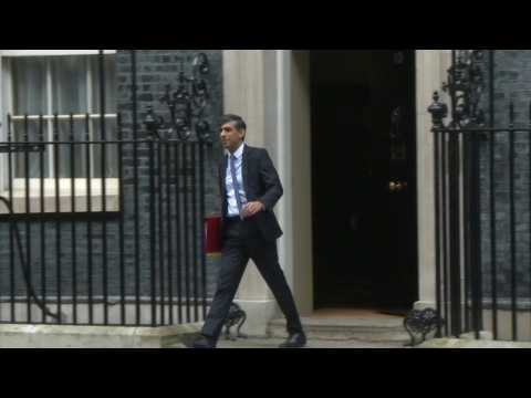 British PM leaves for parliament ahead of budget announcement