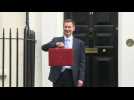 UK finance minister poses with 'red box' ahead of budget delivery