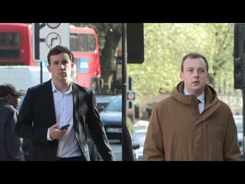 Two British men accused of spying for China arrive at court