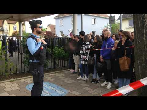 Parents wait to pick-up children from French school near knife attack site