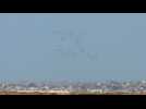 Humanitarian aid parachuted into Gaza by air, seen from Israel