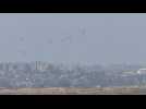 Aid is airdropped over northern Gaza, seen from Israel