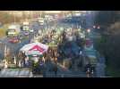 French farmers block motorway near Paris, face police roadblock