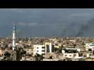 Smoke billows over Gaza's Khan Yunis as seen from Rafah