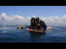 Indonesian authorities rescue stranded Rohingya holding onto overturned boat