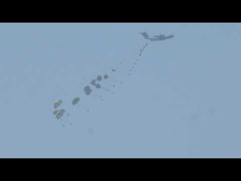 Humanitarian aid parachuted into Gaza by air, seen from Israel