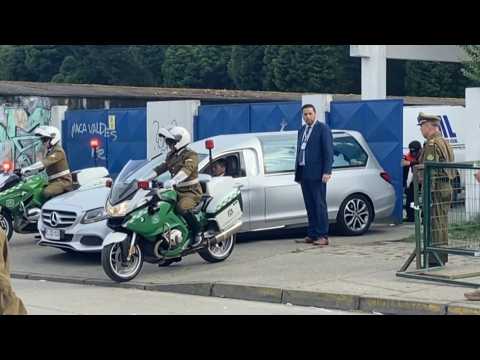 Hearse carrying body of former Chilean President Sebastian Pinera leaves medical building