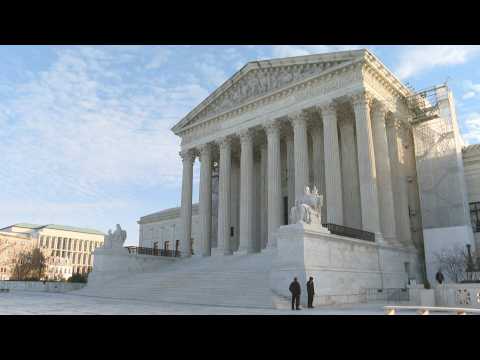Illustrations outside US Supreme Court, to hear Donald Trump's ballot case