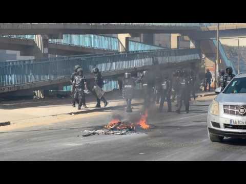Protesters build barricades in Dakar as clashes follow Senegal election postponement