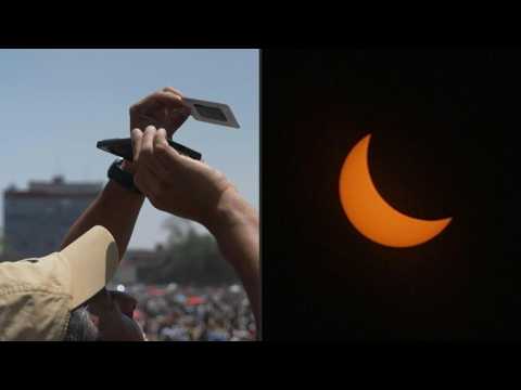 Hundreds of Mexicans watch total solar eclipse in the capital