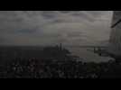People gather in Manhattan to see the partial solar eclipse