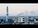 Smoke rises from southern Gaza as the sun sets on the last evening of Ramadan