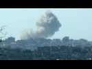 A large plume of smoke rises from nothern Gaza, seen from Israel