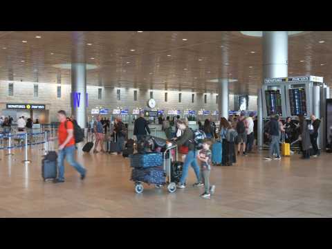 Travellers at Tel Aviv airport after reopening following Iranian attack