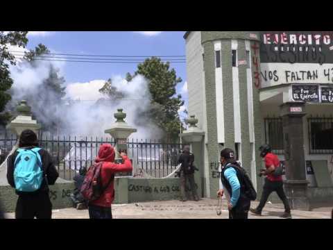 Protesters for disappeared students clash with police in Mexico City