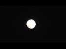Tokyo residents marvel at 'blood moon' eclipse