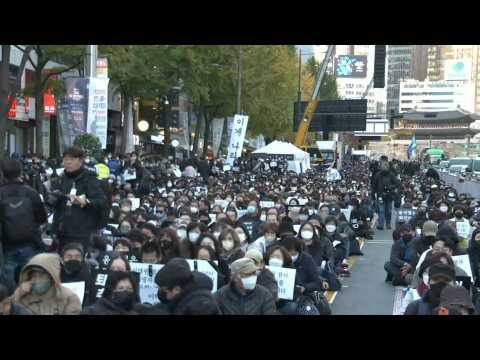 Seoul holds candle lit vigil to remember victims of Halloween crush