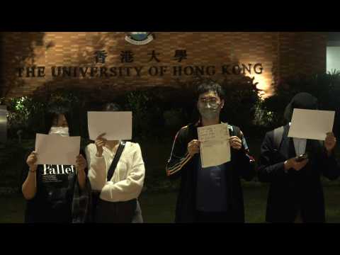 Hong Kongers hold vigil at university campus in solidarity with China protests