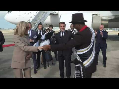 French President Macron dances as he arrives at the airport in New Orleans