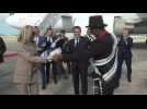 French President Macron dances as he arrives at the airport in New Orleans