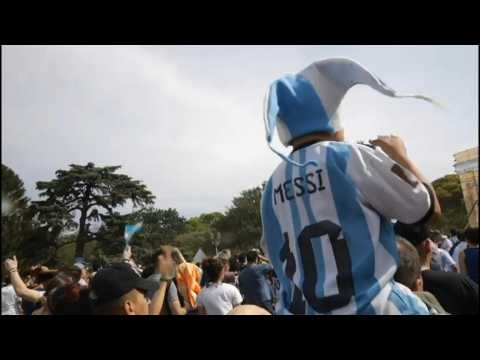 Argentine fans watch the World Cup match against Poland