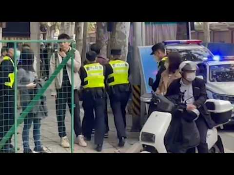 Police detain person in downtown Shanghai on Monday
