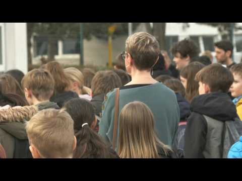Minute of silence held for teacher slain in southwest France