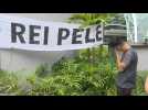 Pele fans mourn his death outside the hospital where Brazil's football legend died