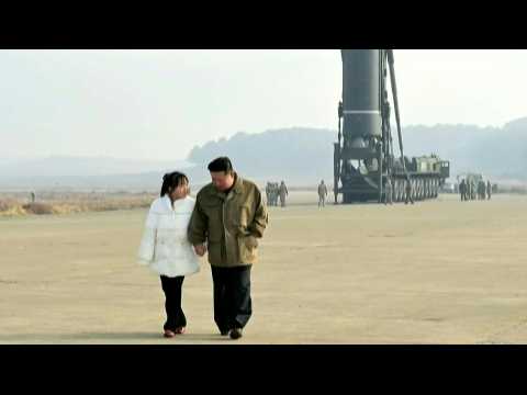 Photos of Kim overseeing North Korean ICBM launch with daughter in tow