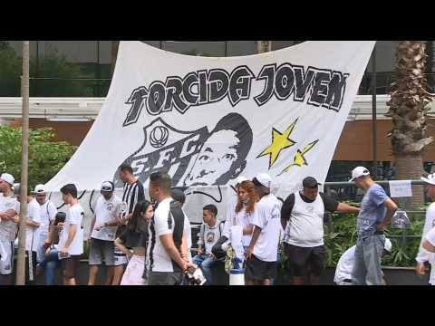 Santos fans pray outside Sao Paulo hospital where Pele is hospitalized